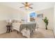 Cozy bedroom with a ceiling fan, a plush bed, and a bright window view at 2231 S Vaughn Way # 317 B, Aurora, CO 80014