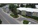 View of building with parking and mature landscaping creating an inviting atmosphere at 2231 S Vaughn Way # 317 B, Aurora, CO 80014