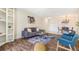 Inviting living room featuring modern decor, hardwood floors, and a stylish area rug at 2231 S Vaughn Way # 317 B, Aurora, CO 80014