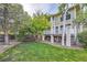 Backyard with a spacious lawn and a raised deck, perfect for outdoor entertaining at 360 Morning Star Ln, Lafayette, CO 80026