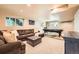 Cozy basement with carpeted floors, a comfortable sectional sofa, and a pool table at 360 Morning Star Ln, Lafayette, CO 80026