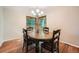 Bright dining room featuring hardwood floors, an oval table, and two large windows offering natural light at 360 Morning Star Ln, Lafayette, CO 80026