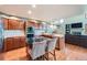 Well-appointed kitchen with modern appliances, center island, and stylish barstools at 360 Morning Star Ln, Lafayette, CO 80026