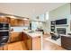 Kitchen with stainless steel appliances, a breakfast bar, and hardwood floors at 360 Morning Star Ln, Lafayette, CO 80026