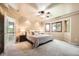 Spacious main bedroom with tray ceiling, carpet, and a bay window providing ample natural light at 360 Morning Star Ln, Lafayette, CO 80026