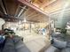 Spacious unfinished basement with exposed ceiling, room for storage and living space, offering potential for customization at 12830 Jasmine St # A, Thornton, CO 80602