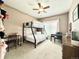 Cozy bedroom featuring a bunk bed, study space, and ceiling fan at 12830 Jasmine St # A, Thornton, CO 80602