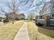Well-maintained community pathway with manicured lawns and inviting residential buildings at 12830 Jasmine St # A, Thornton, CO 80602