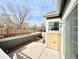 Cozy outdoor patio, perfect for relaxing, with a stone wall and sliding glass door access at 12830 Jasmine St # A, Thornton, CO 80602