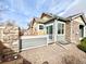 Cozy outdoor patio, perfect for relaxing, with a stone wall and sliding glass door access at 12830 Jasmine St # A, Thornton, CO 80602