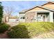 Cozy outdoor patio, perfect for relaxing, with a stone wall and sliding glass door access at 12830 Jasmine St # A, Thornton, CO 80602
