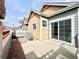 Cozy outdoor patio, perfect for relaxing, with a stone wall and sliding glass door access at 12830 Jasmine St # A, Thornton, CO 80602