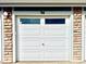 A well-maintained garage door featuring brick accents and a clean, modern design at 12830 Jasmine St # A, Thornton, CO 80602