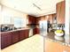 Bright kitchen with stainless steel appliances, granite countertops, and plenty of natural light at 12830 Jasmine St # A, Thornton, CO 80602