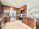 Modern kitchen featuring stainless steel appliances, abundant cabinetry, and granite countertops at 12830 Jasmine St # A, Thornton, CO 80602