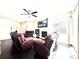 Inviting living room featuring comfortable seating, a cozy fireplace, and a mounted television for relaxation and entertainment at 12830 Jasmine St # A, Thornton, CO 80602