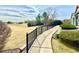 Scenic walkway with lush landscaping, offering a tranquil path and inviting atmosphere at 12830 Jasmine St # A, Thornton, CO 80602