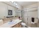 Functional bathroom with a glass shower, large mirror and neutral colors at 460 S Marion Pkwy # 102, Denver, CO 80209