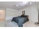 The bedroom has large closets, brick accent wall, ceiling fan and neutral carpet at 460 S Marion Pkwy # 102, Denver, CO 80209