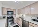 Modern kitchen with stainless steel appliances, sleek cabinetry, and granite countertops at 460 S Marion Pkwy # 102, Denver, CO 80209