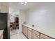 Bright and spacious kitchen featuring plenty of counter space, tile floors, and modern appliances at 460 S Marion Pkwy # 102, Denver, CO 80209