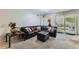 Comfortable living room with large sofa and sliding glass doors to patio at 460 S Marion Pkwy # 102, Denver, CO 80209