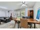 Bright living and dining area with modern furnishings and plenty of natural light at 460 S Marion Pkwy # 102, Denver, CO 80209