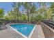 Outdoor pool area with ample deck space and lounge chairs at 460 S Marion Pkwy # 102, Denver, CO 80209