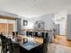Elegant dining room with a large table and access to the kitchen and outdoor area at 4391 S Tabor Ct, Morrison, CO 80465