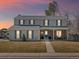 Charming two-story home featuring blue shutters and a welcoming front porch at 4391 S Tabor Ct, Morrison, CO 80465