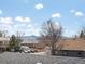 Scenic view from home featuring neighborhood rooftops and distant mountain range, for tranquil scenery at 4391 S Tabor Ct, Morrison, CO 80465