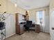 Cozy home office featuring a wooden desk, chair, and a window with natural light at 4391 S Tabor Ct, Morrison, CO 80465