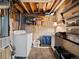 Functional laundry area in basement with washer, dryer, and storage shelves at 4391 S Tabor Ct, Morrison, CO 80465