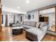 Spacious living room featuring modern decor, hardwood floors, and comfortable seating at 4391 S Tabor Ct, Morrison, CO 80465