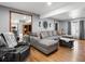 Bright living room boasting a large sectional sofa, hardwood floors, and stylish accents at 4391 S Tabor Ct, Morrison, CO 80465