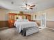Spacious bedroom featuring a built-in headboard and walk in closet at 4391 S Tabor Ct, Morrison, CO 80465