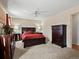 Bedroom with a fan and matching furniture, providing a comfortable and stylish space at 4391 S Tabor Ct, Morrison, CO 80465