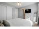 Spacious bedroom with a large bed, dresser, and a door leading to a bathroom at 15800 E 121St Ave # 4G, Brighton, CO 80603