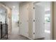 Hallway with neutral carpet leading to bedrooms, offering a seamless transition between spaces at 15800 E 121St Ave # 4G, Brighton, CO 80603