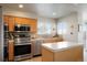 Bright kitchen featuring stainless steel appliances, ample counter space, and a functional layout at 15800 E 121St Ave # 4G, Brighton, CO 80603
