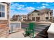 Cozy patio perfect for outdoor relaxation, complete with a green rocking chair at 15800 E 121St Ave # 4G, Brighton, CO 80603