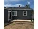 Back exterior of the home with a concrete patio, perfect for outdoor relaxation and entertainment at 1100 N Hanover St, Aurora, CO 80010