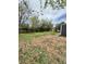 Backyard featuring green grass and trees, offering a serene and natural setting at 1100 N Hanover St, Aurora, CO 80010