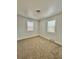 Bedroom featuring plush carpet, fresh paint, and natural lighting at 1100 N Hanover St, Aurora, CO 80010