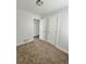 Bright bedroom featuring plush carpet, fresh paint, and two large closet at 1100 N Hanover St, Aurora, CO 80010
