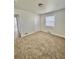 Cozy bedroom with neutral carpet, white walls, and plenty of natural light at 1100 N Hanover St, Aurora, CO 80010