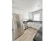Modern kitchen with white cabinets and stainless steel appliances at 1100 N Hanover St, Aurora, CO 80010