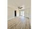 Bright living room with wood floors, ceiling fan, and sliding glass doors to outside at 1100 N Hanover St, Aurora, CO 80010