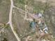 Bird's eye view of the acreage, highlighting the homesite, outbuildings, and landscape at 3559 Meadow Ln, Brighton, CO 80603