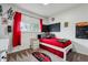 Fun bedroom design with red accents, themed decor, and a comfortable bed at 3559 Meadow Ln, Brighton, CO 80603